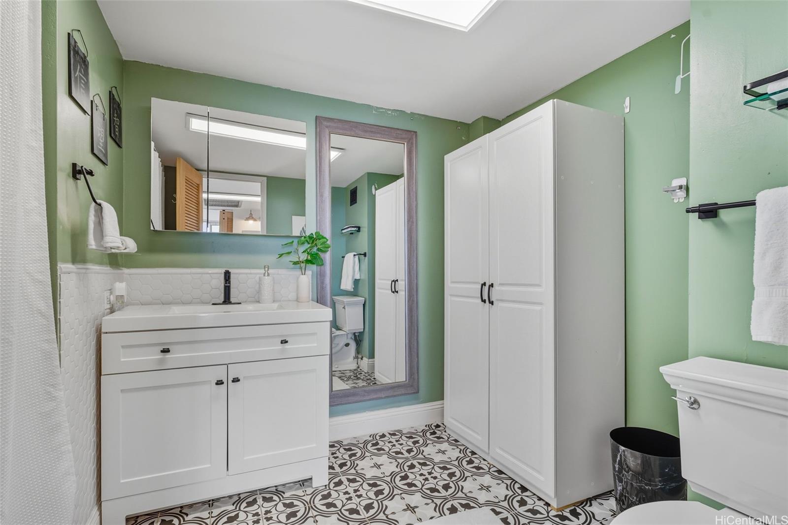 84-770 Kili Drive, Unit 434 Waianae, HI 96792 - Photo 9 of 13 a spacious bathroom with a granite countertop sink toilet and shower