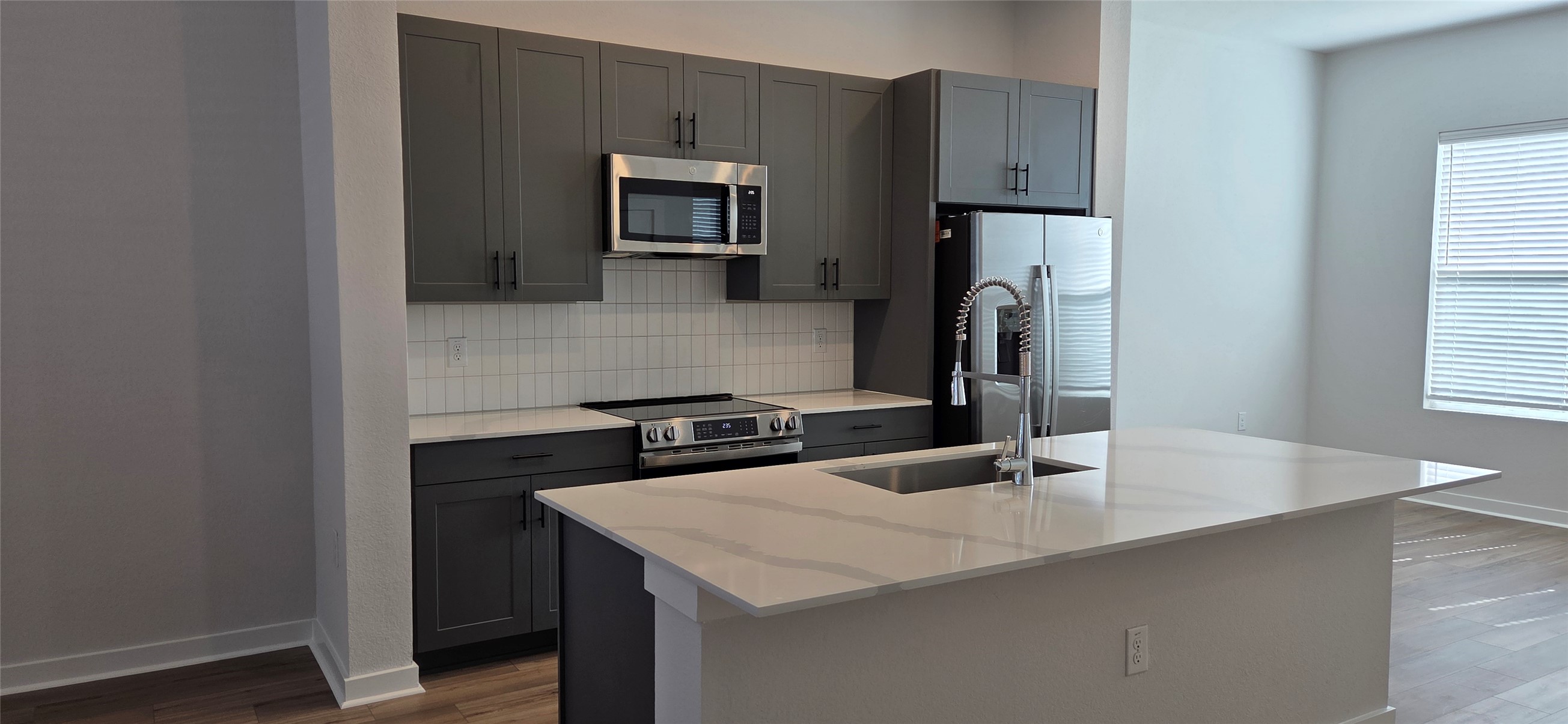 8107 Wilder Road Austin, TX 78736 - Photo 2 of 35 Culinary delights await in this modern kitchen with ample counter space and sleek appliances.