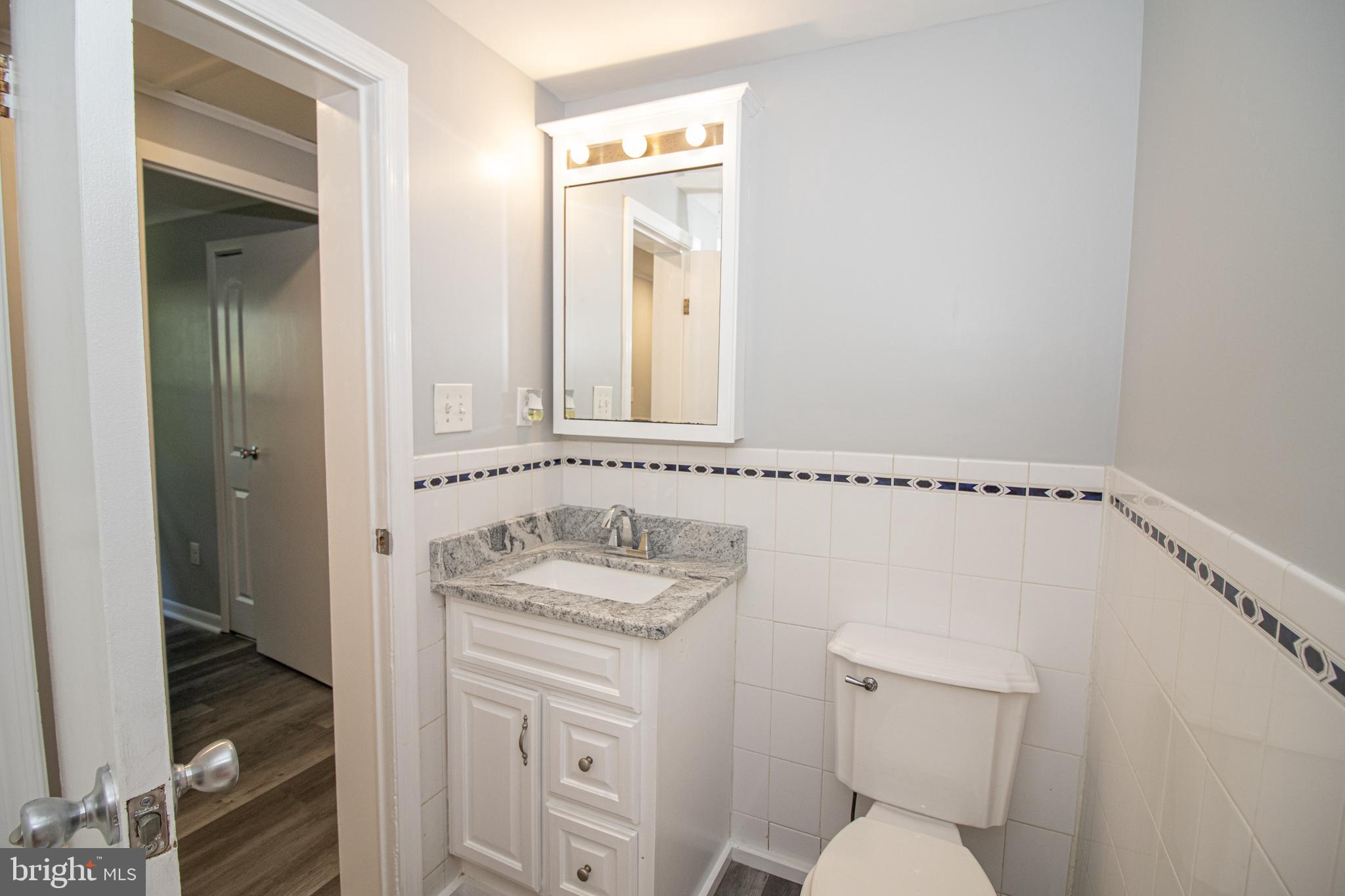 5741 Stephen Reid Road Huntingtown, MD 20639 - Photo 25 of 46 Main floor hall bath