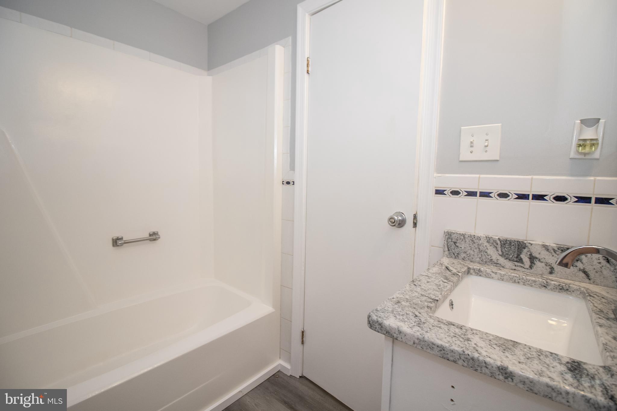 5741 Stephen Reid Road Huntingtown, MD 20639 - Photo 26 of 46 Hall bath with new granite top