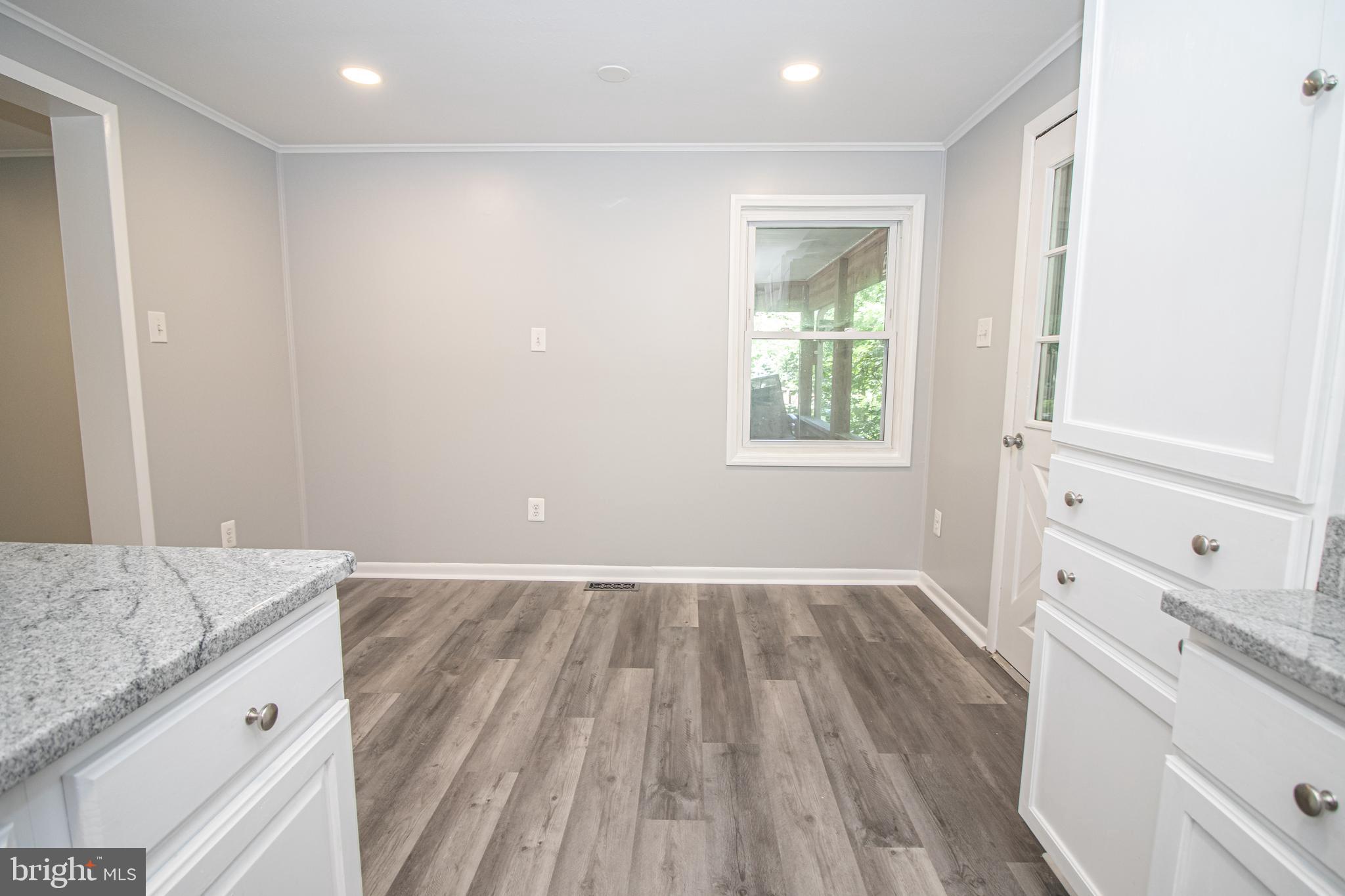 5741 Stephen Reid Road Huntingtown, MD 20639 - Photo 31 of 46 Space for table and door to deck