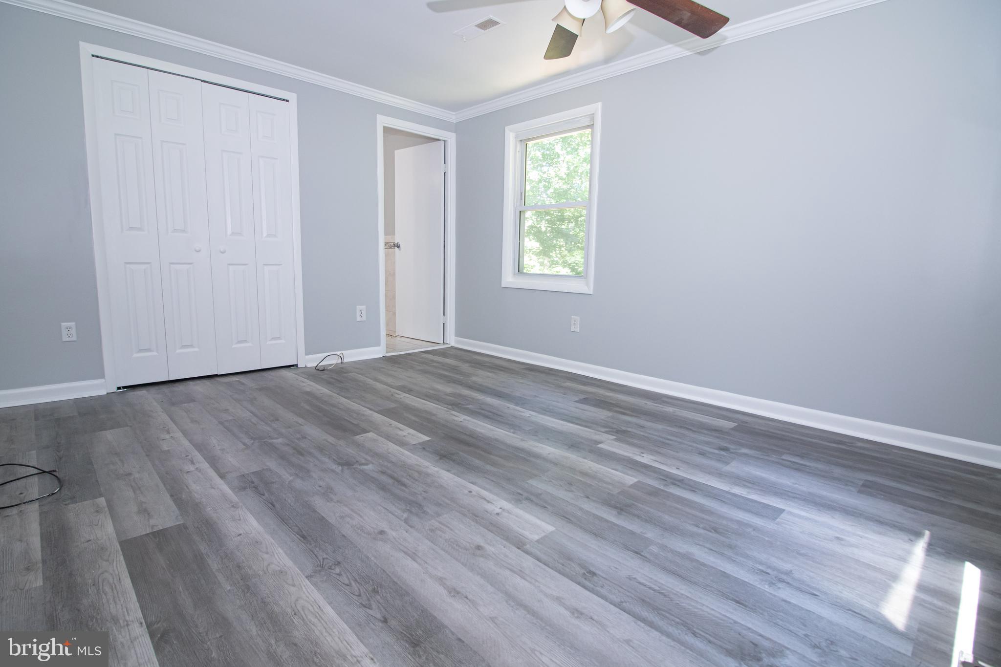 5741 Stephen Reid Road Huntingtown, MD 20639 - Photo 10 of 46 Master bedroom with ceiling fan
