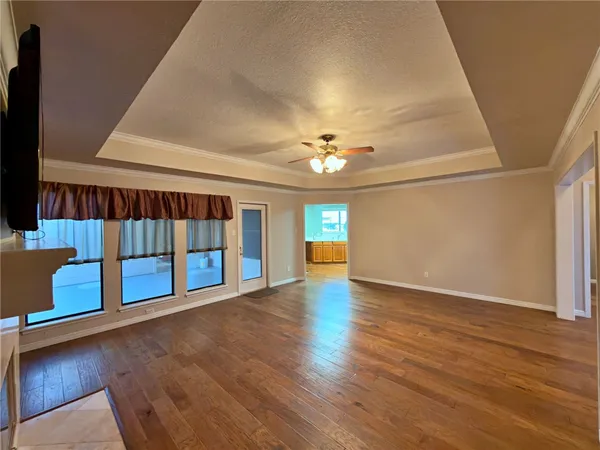 a view of an entryway with wooden floor