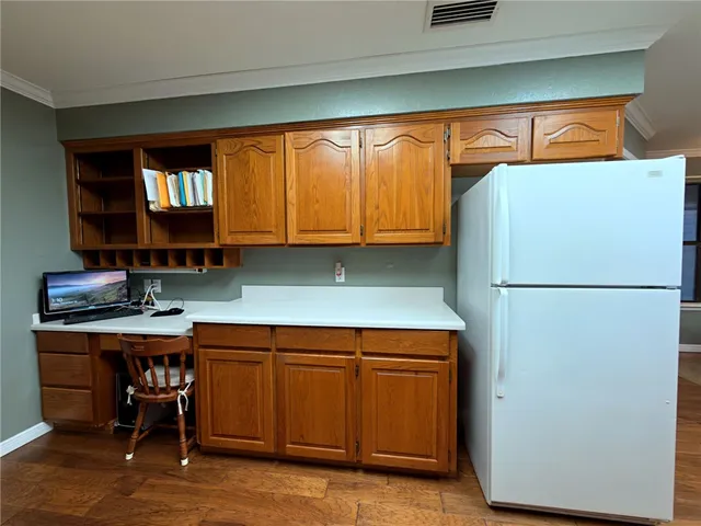 a bedroom with bed and a chandelier