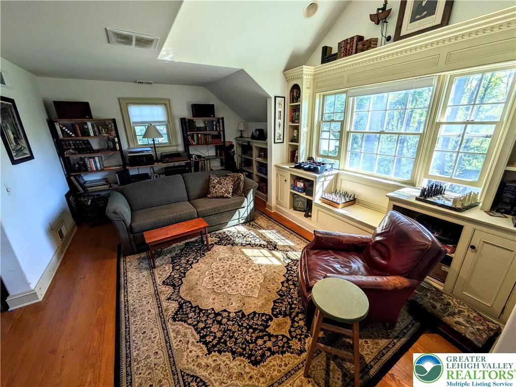 1731 Howell Road Easton, PA 18040 - Photo 35 of 60 Rich wood floors and extensive custom built-ins define this comfortable, light-filled space.