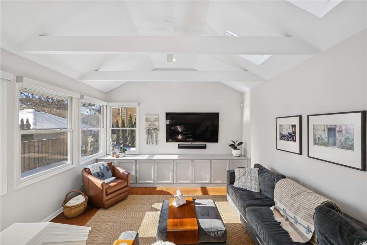 2740 Asbury Avenue Evanston, IL 60201 - Photo 14 of 40 a living room with furniture and a flat screen tv