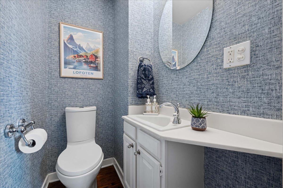 2740 Asbury Avenue Evanston, IL 60201 - Photo 16 of 40 a bathroom with a toilet sink and mirror