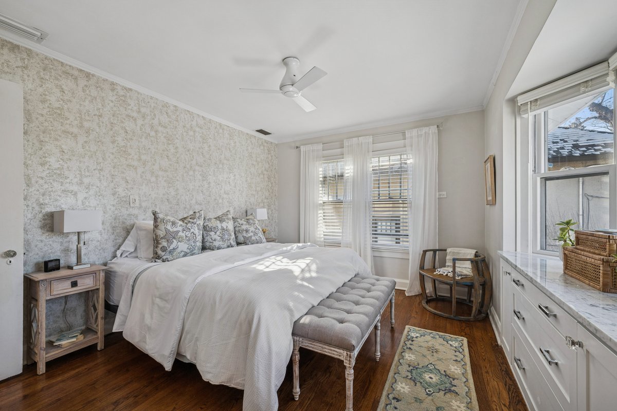 2740 Asbury Avenue Evanston, IL 60201 - Photo 18 of 40 a bedroom with a bed and a chandelier