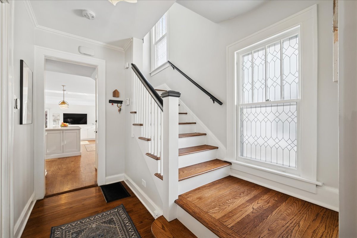 2740 Asbury Avenue Evanston, IL 60201 - Photo 4 of 40 a view of entryway with wooden floor and stair