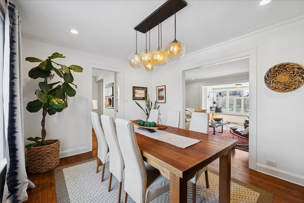 2740 Asbury Avenue Evanston, IL 60201 - Photo 10 of 40 a view of a dining room with furniture and chandelier