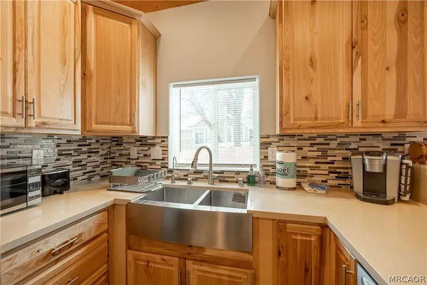 a kitchen with a sink and cabinets