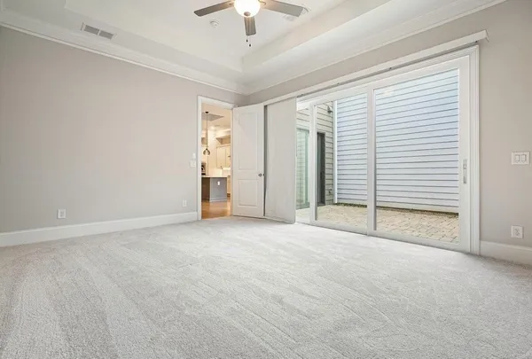 a living room with furniture a table and wooden floor