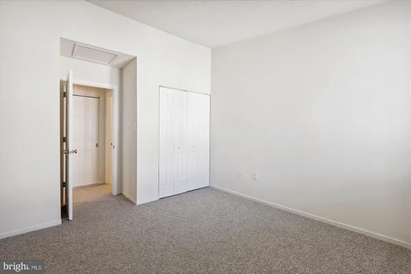 a room with a refrigerator and cabinets