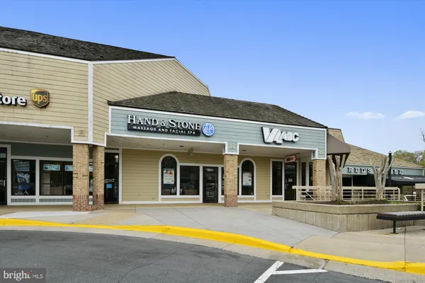 a view of a swimming pool with a garden and trees
