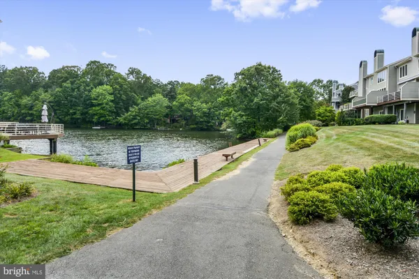 a swimming pool view with a outdoor seating