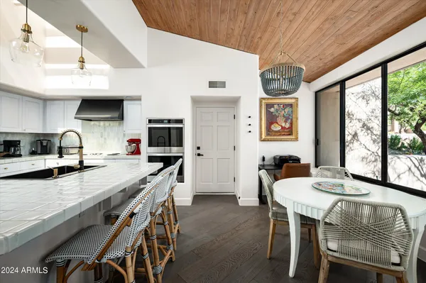 a view of a dining room with furniture window and outside view