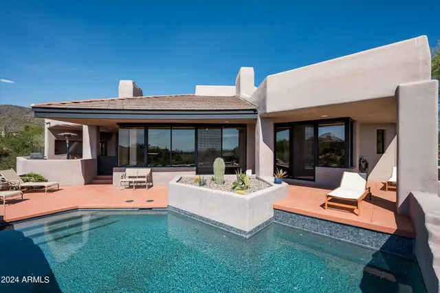 a view of an house with backyard porch and patio