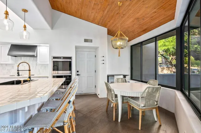 a view of a dining room with furniture window and outside view