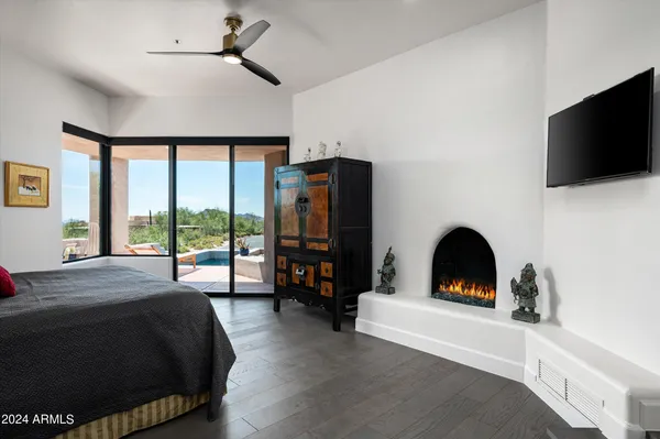 a living room with fireplace furniture and a flat screen tv