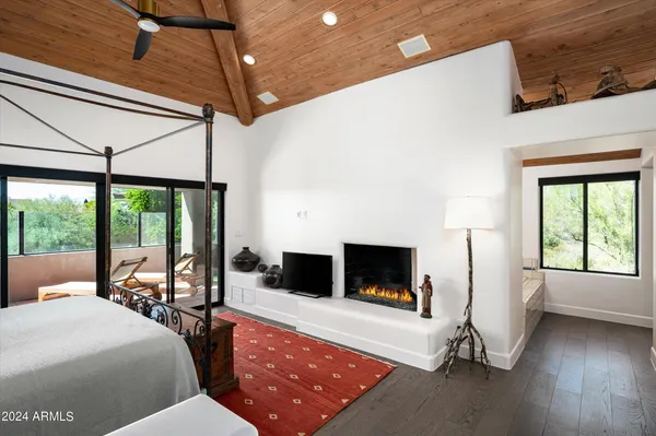 a living room with furniture tv and a fireplace