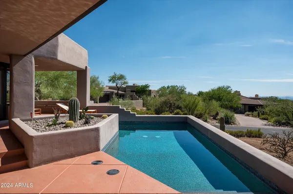 a terrace with outdoor seating and garden
