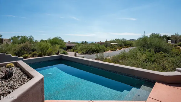 a view of balcony with furniture