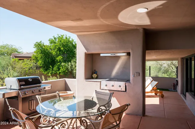 a outdoor space with furniture and fireplace