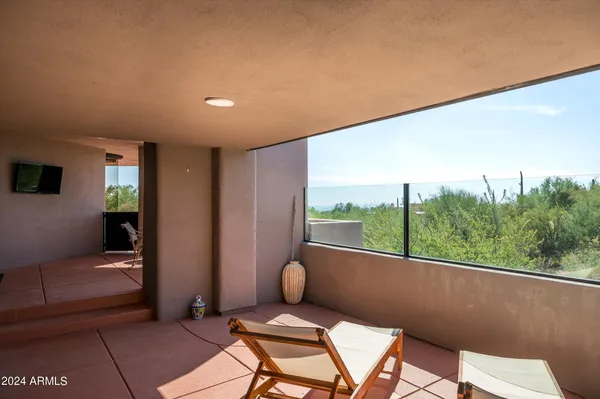 a balcony with furniture