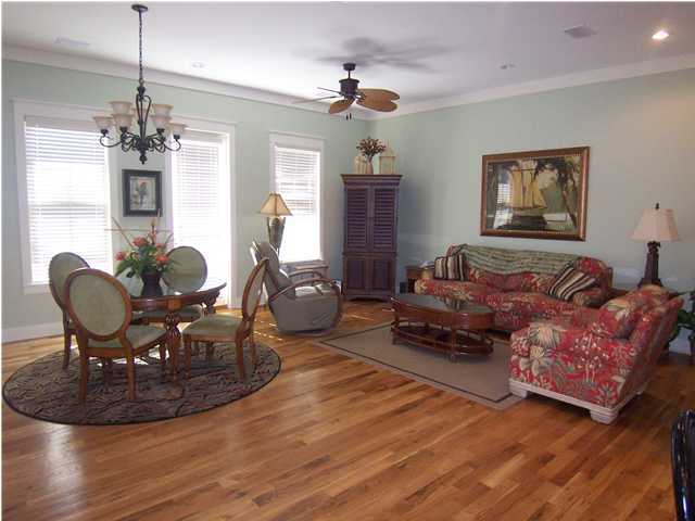 10140 Co Hwy Inlet Beach, Unit 33 30A Inlet Beach, FL 32461 - Photo 2 of 13 a living room with furniture chandelier and a fireplace