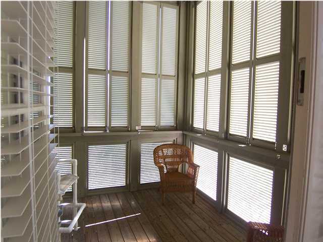 10140 Co Hwy Inlet Beach, Unit 33 30A Inlet Beach, FL 32461 - Photo 9 of 13 a view of front door with lounge chair and windows