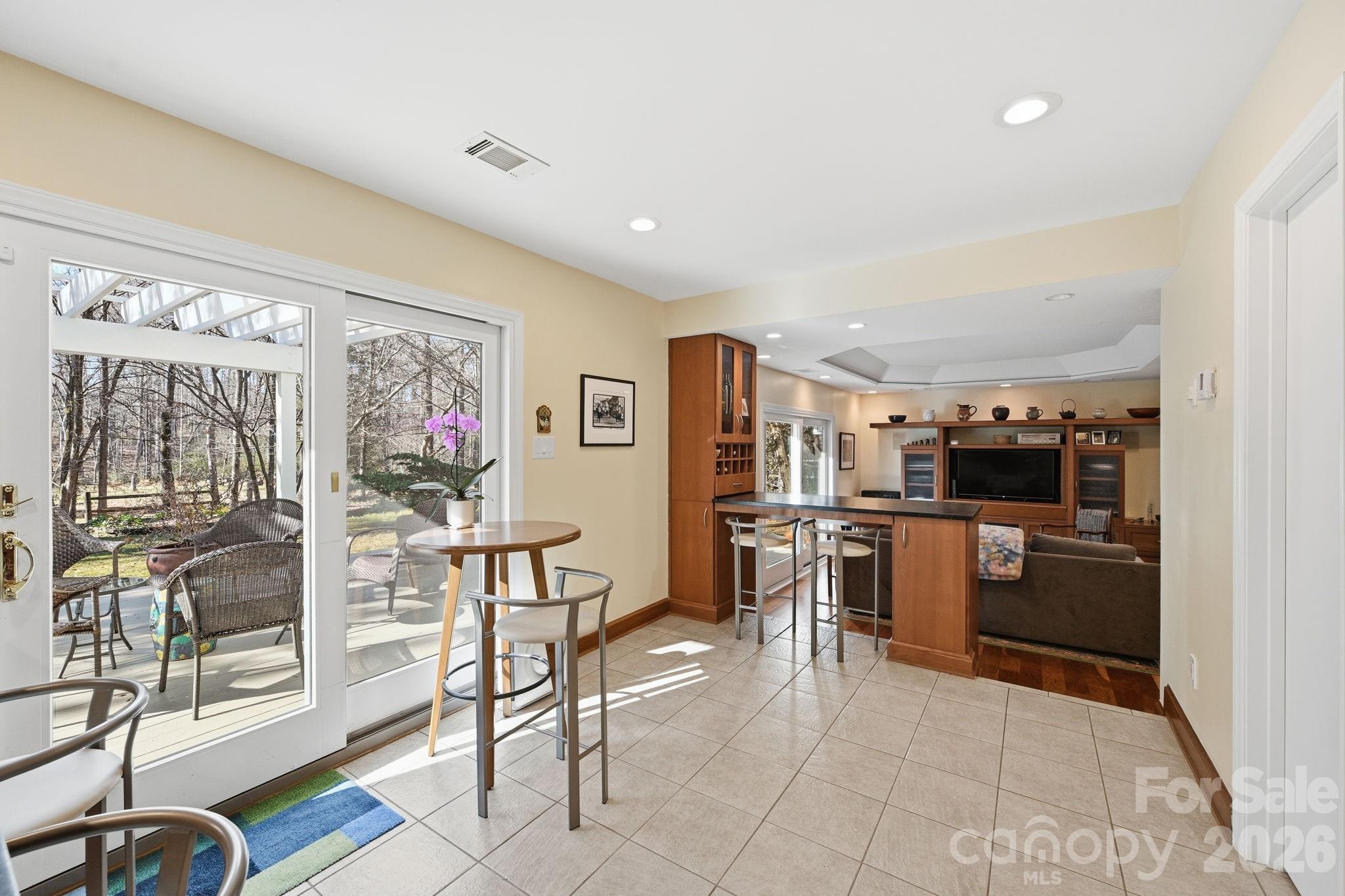 1916 Davis Road Davidson, NC 28036 - Photo 14 of 45 a kitchen with stainless steel appliances kitchen island granite countertop a refrigerator and cabinets