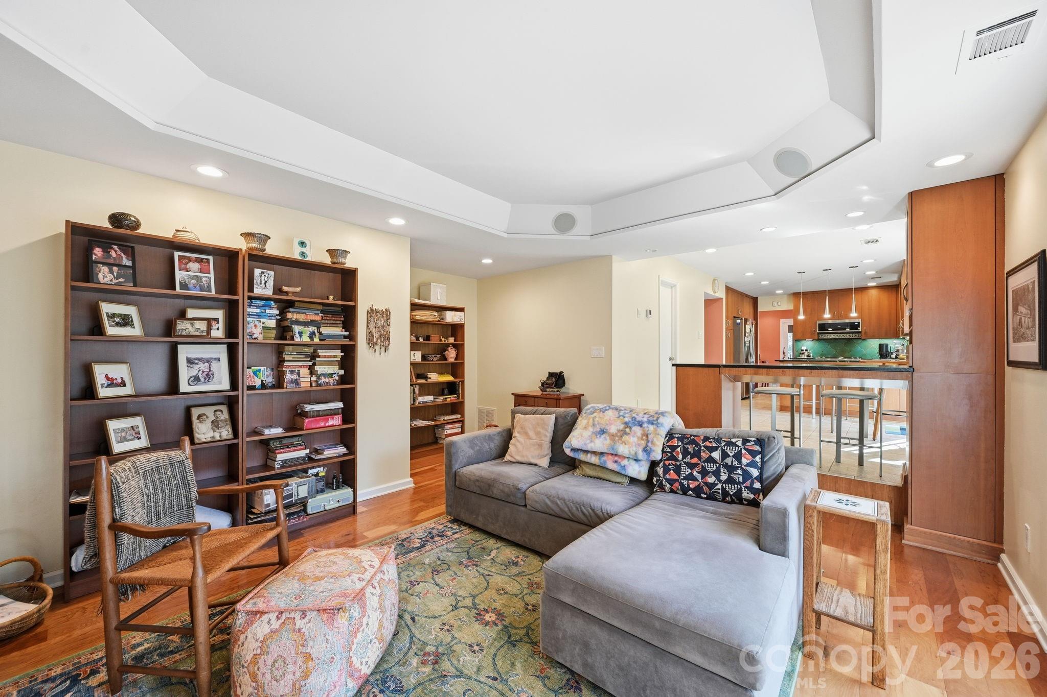 1916 Davis Road Davidson, NC 28036 - Photo 18 of 45 a living room with furniture and a book shelf