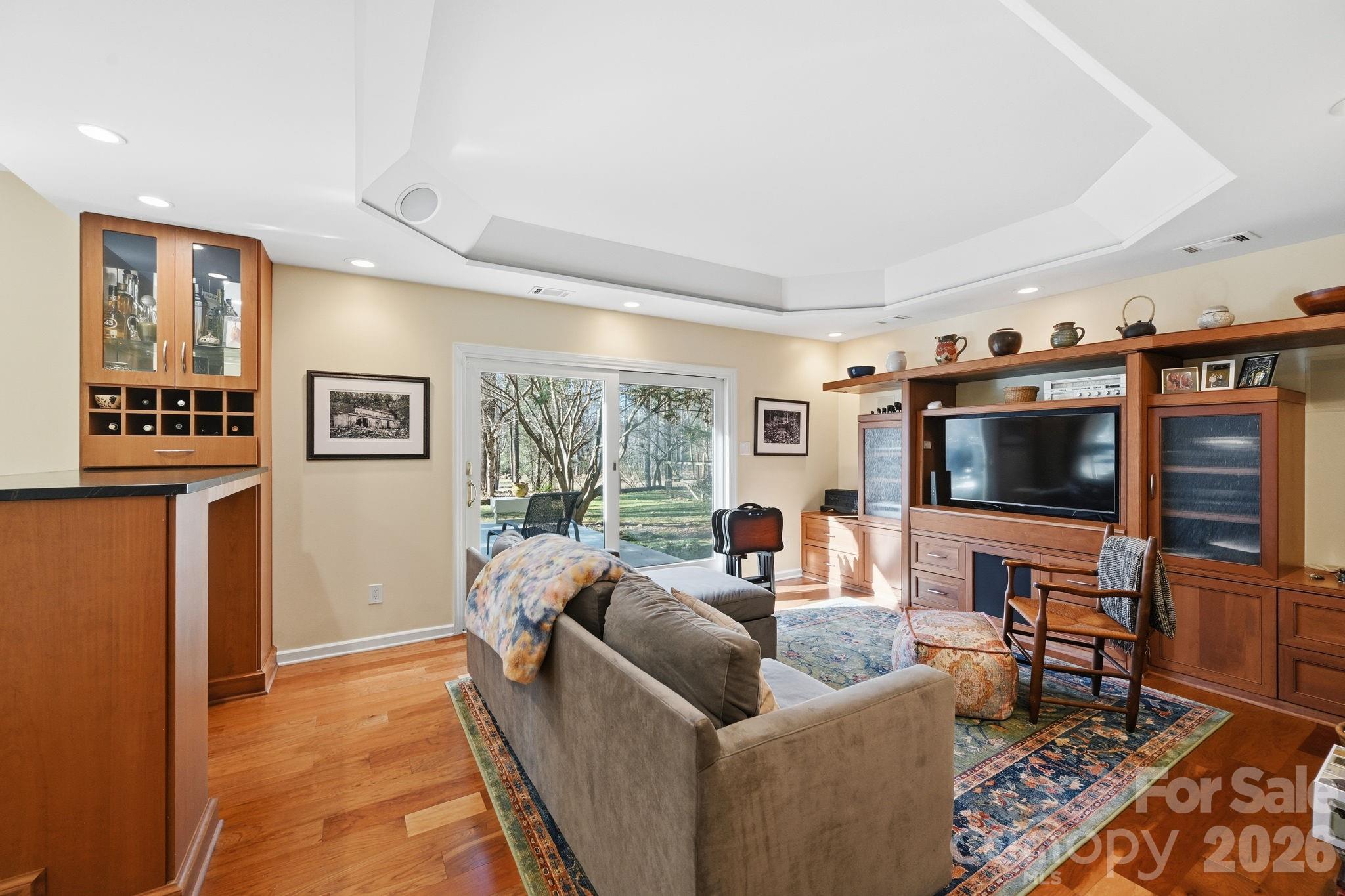 1916 Davis Road Davidson, NC 28036 - Photo 19 of 45 a living room with furniture and a flat screen tv