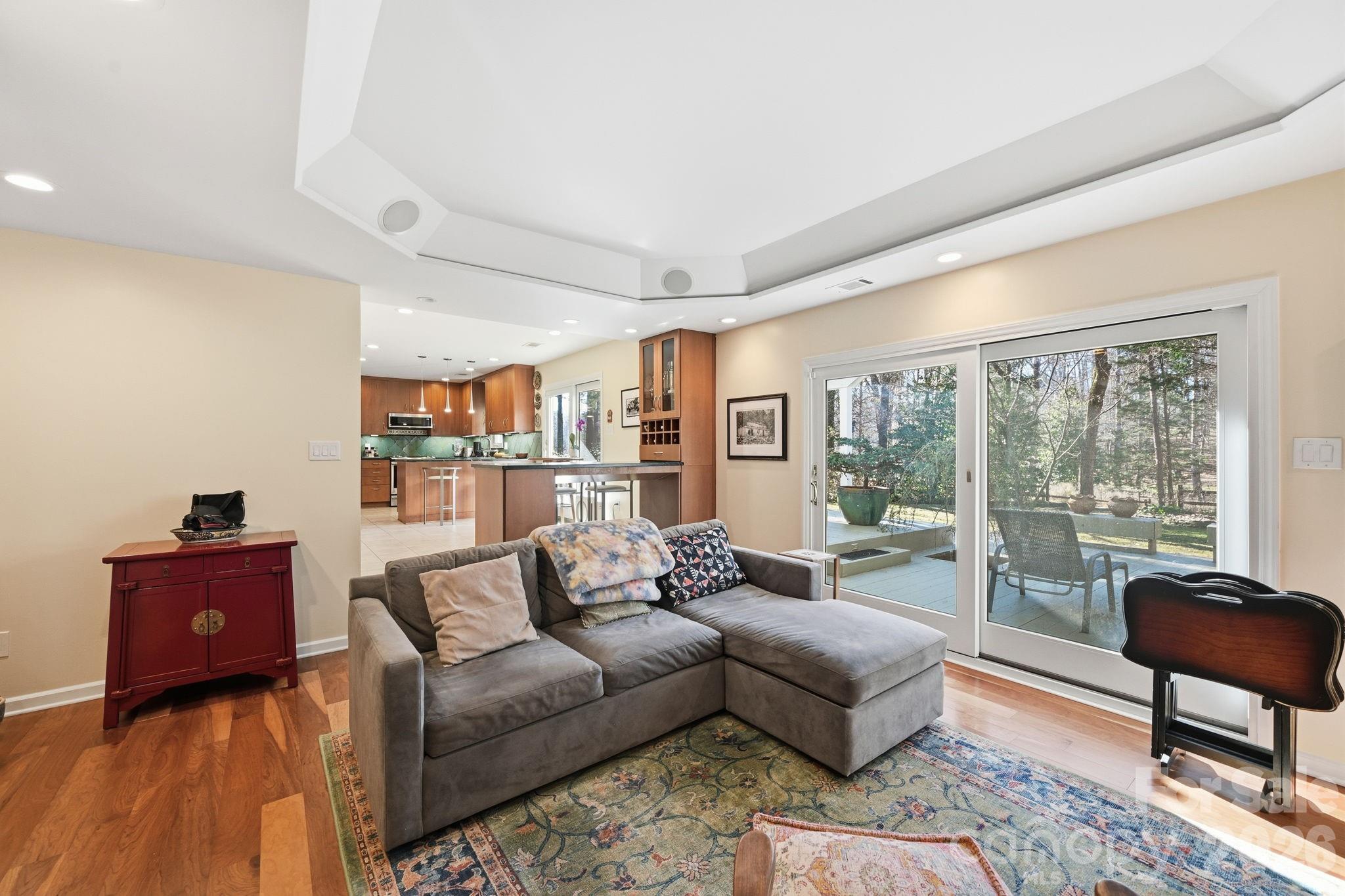 1916 Davis Road Davidson, NC 28036 - Photo 20 of 45 a living room with furniture and a floor to ceiling window