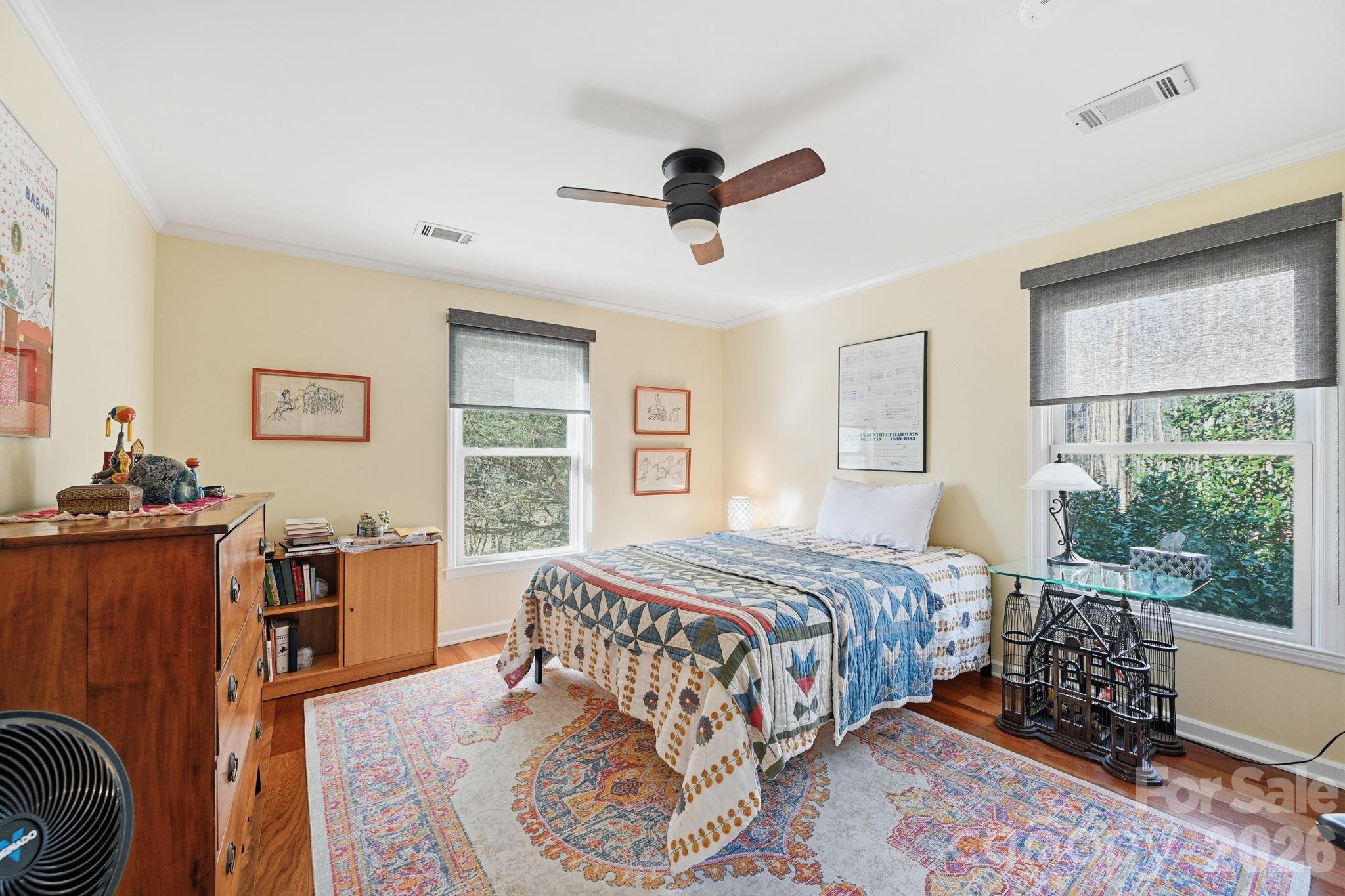 1916 Davis Road Davidson, NC 28036 - Photo 29 of 45 a bedroom with a bed and wooden floor