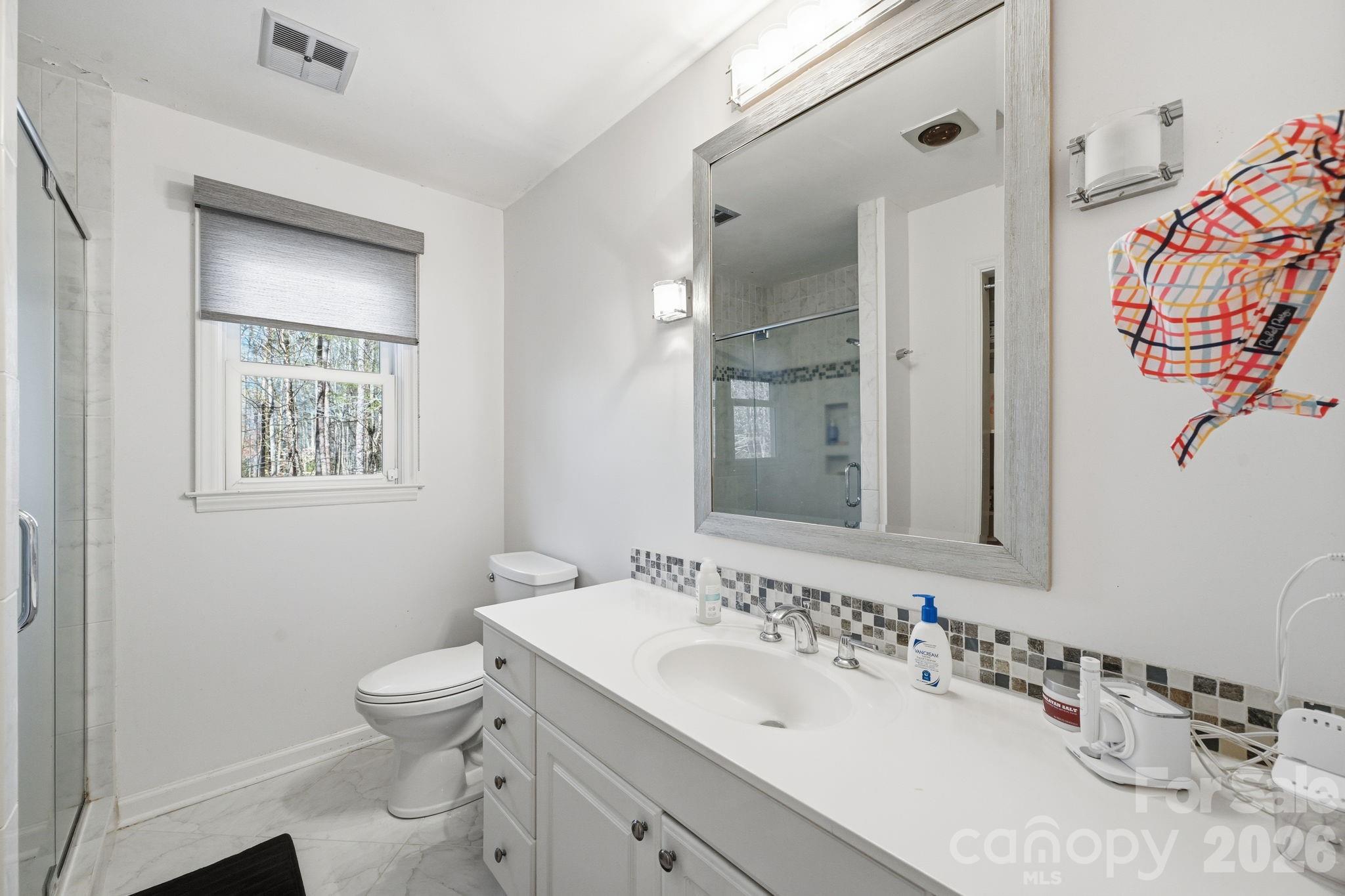 1916 Davis Road Davidson, NC 28036 - Photo 31 of 45 a bathroom with a sink toilet and shower