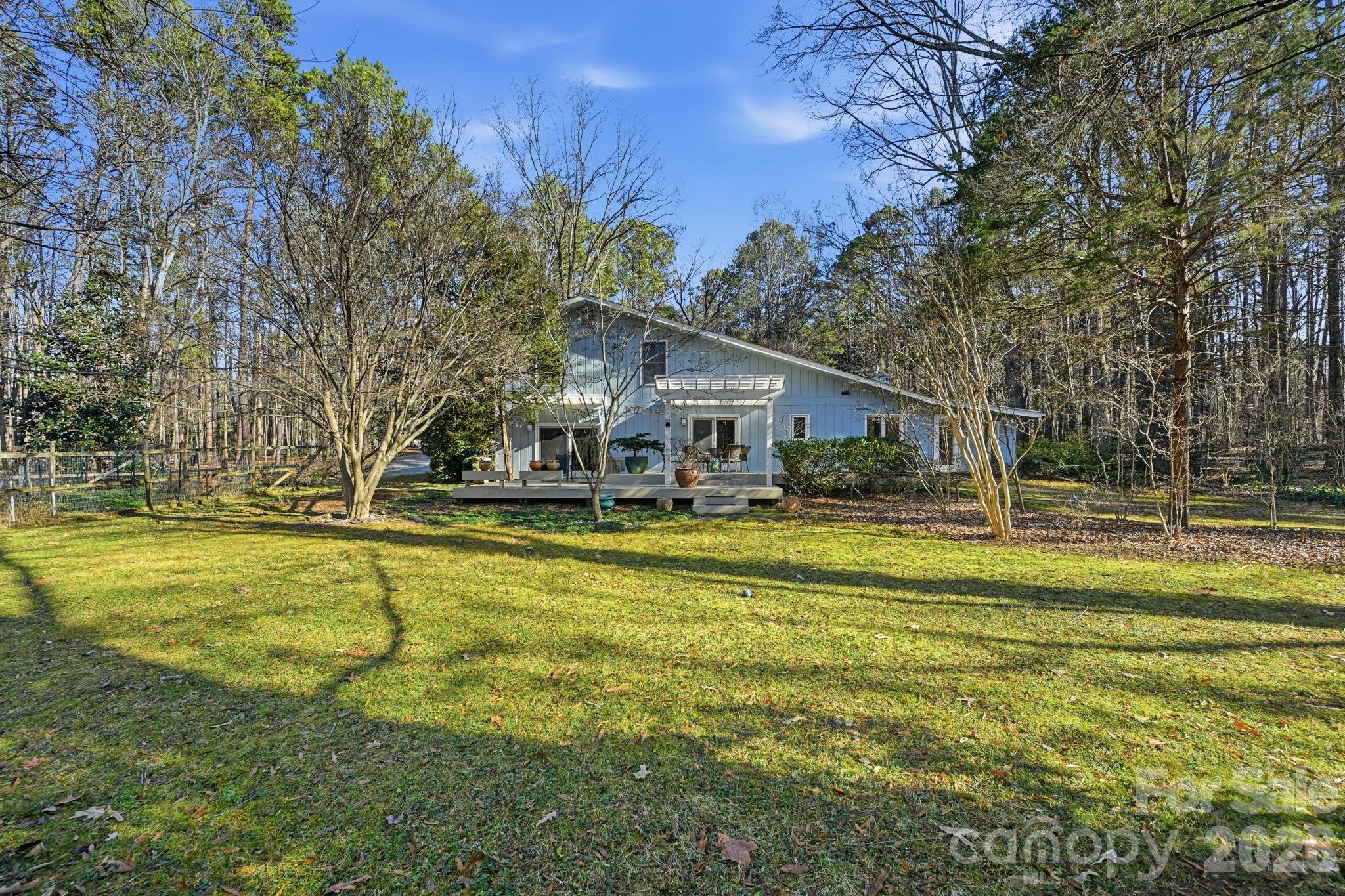 1916 Davis Road Davidson, NC 28036 - Photo 35 of 45 a view of swimming pool with outdoor seating and yard
