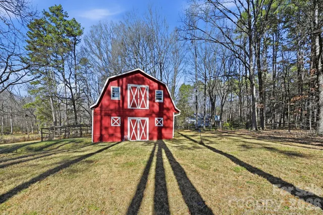 a view of swimming pool with a yard