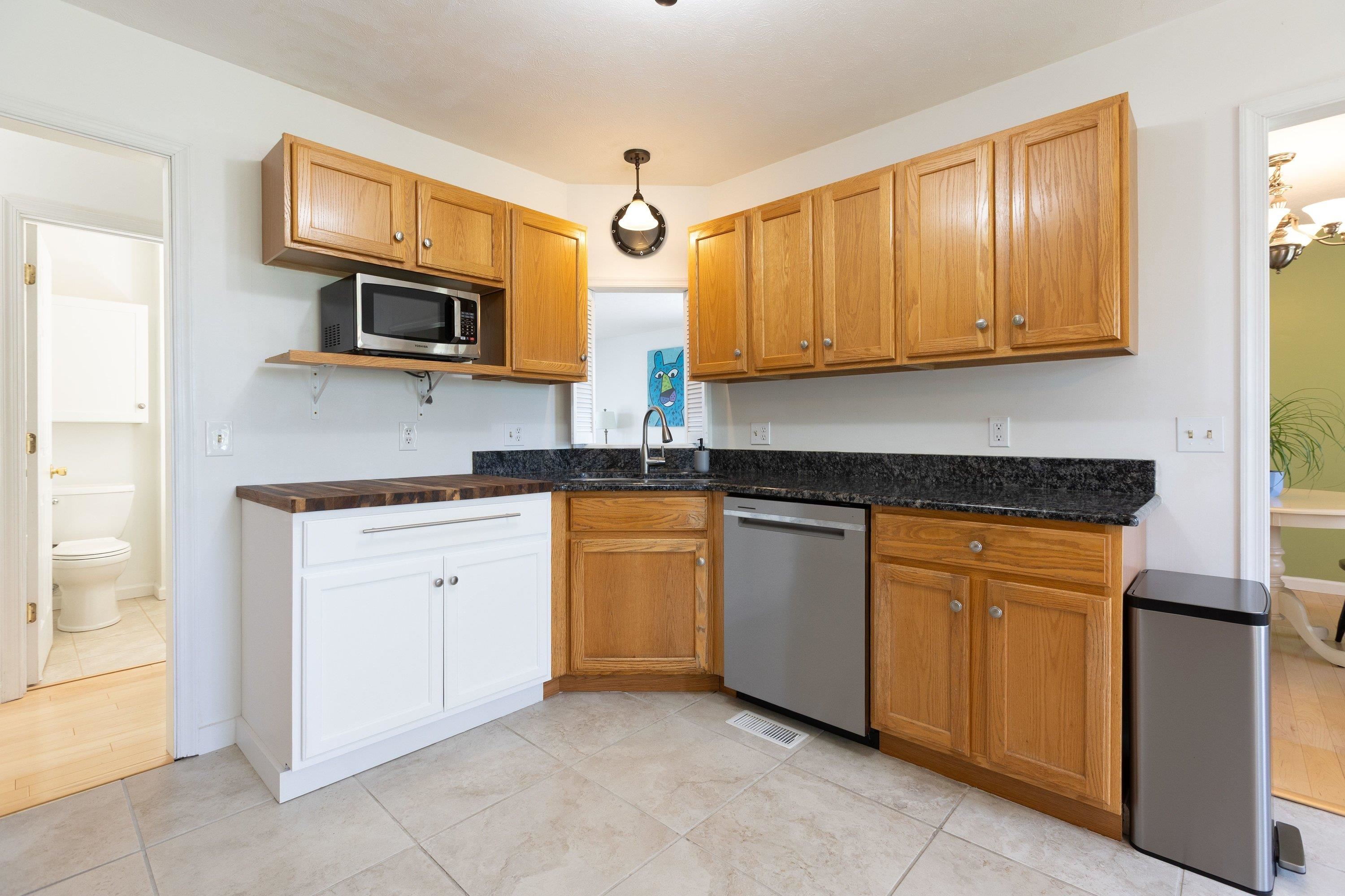 536 Three Leagues Road McGaheysville, VA 22840 - Photo 11 of 71 a kitchen with stainless steel appliances granite countertop a sink dishwasher a stove and a microwave oven with cabinets
