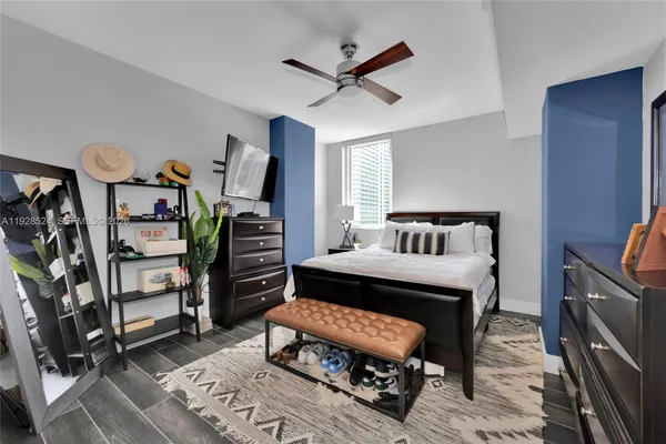 a bedroom with furniture and a gym equipment