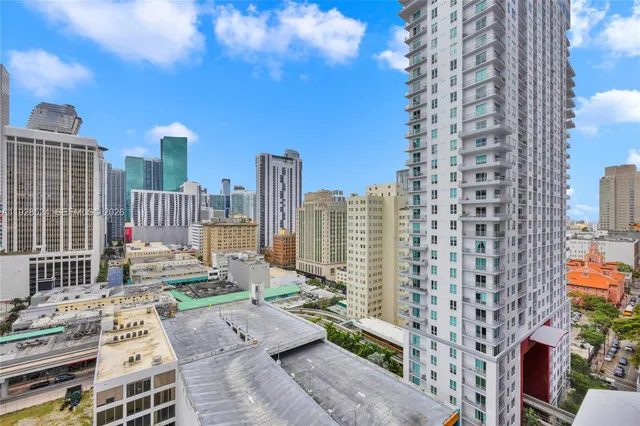 a view of city with tall buildings