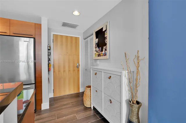 a view of hallway with wooden floor