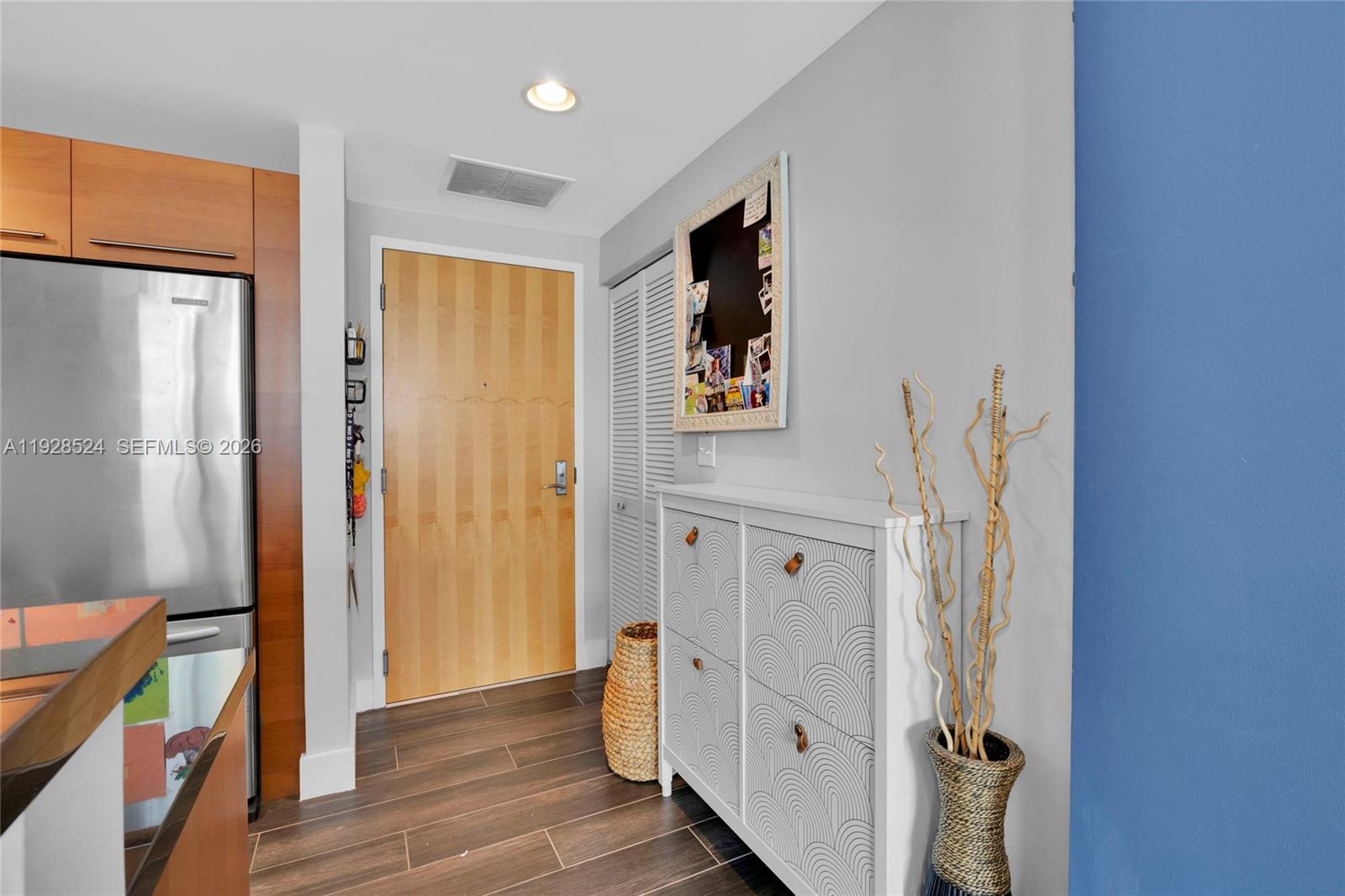 253 Northeast 2nd Street, Unit 1710 Miami, FL 33132 - Photo 7 of 22 a view of hallway with wooden floor