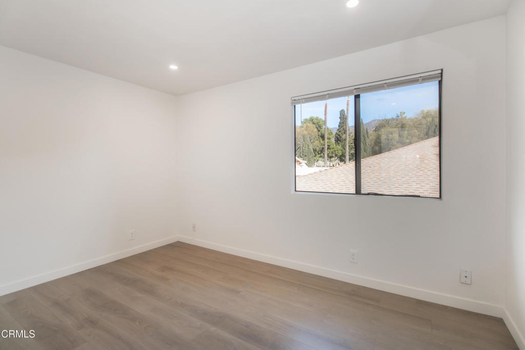 1169 Rosedale Avenue, Unit 204 Glendale, CA 91201 - Photo 13 of 27 wooden floor in an empty room with a window