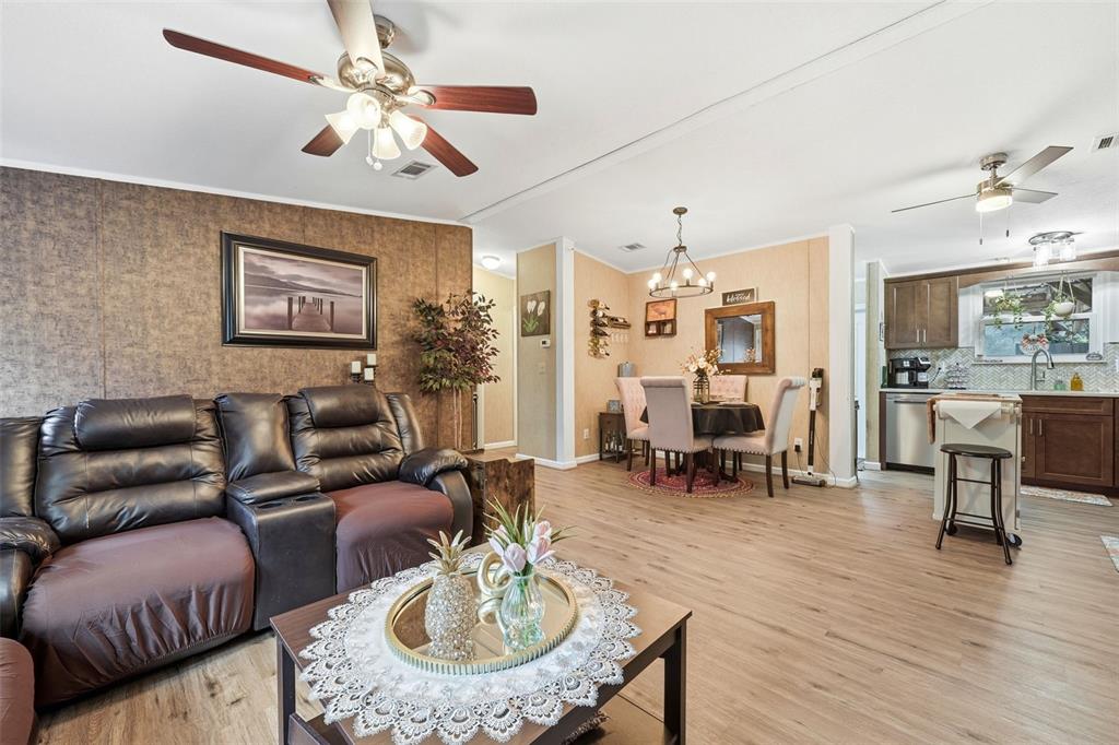 104 Ferncreek Drive Georgetown, FL 32139 - Photo 11 of 52 a living room with furniture kitchen view and a dining table