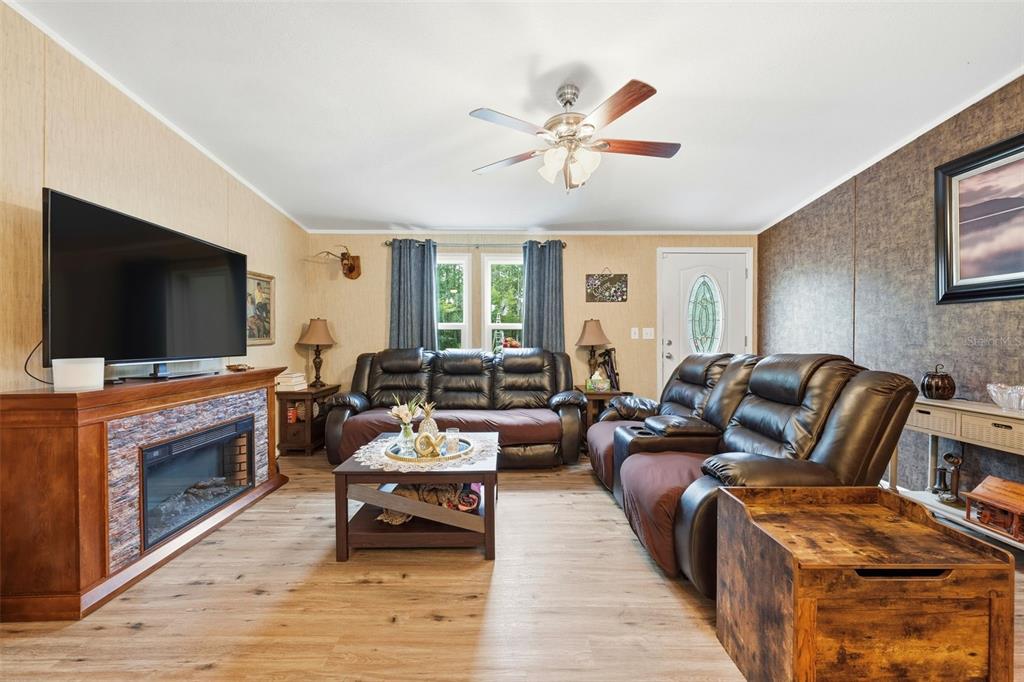 104 Ferncreek Drive Georgetown, FL 32139 - Photo 12 of 52 a living room with furniture and a flat screen tv