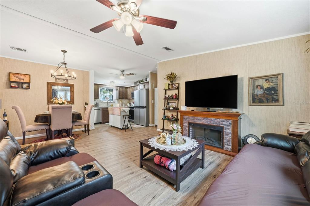 104 Ferncreek Drive Georgetown, FL 32139 - Photo 13 of 52 a living room with furniture and a flat screen tv