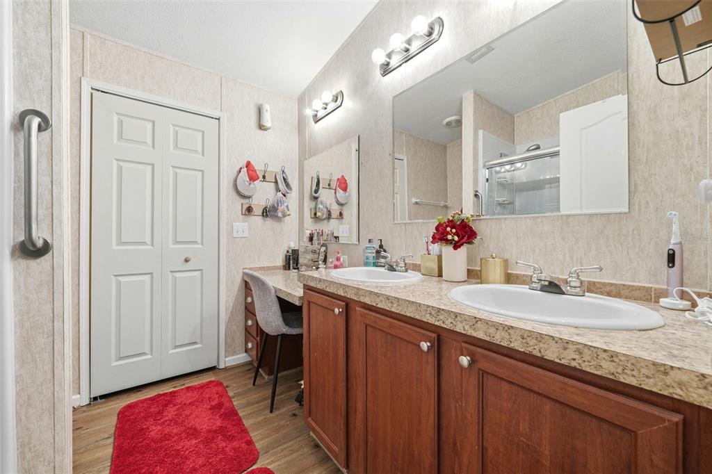 104 Ferncreek Drive Georgetown, FL 32139 - Photo 16 of 52 a bathroom with a granite countertop sink a mirror and a shower