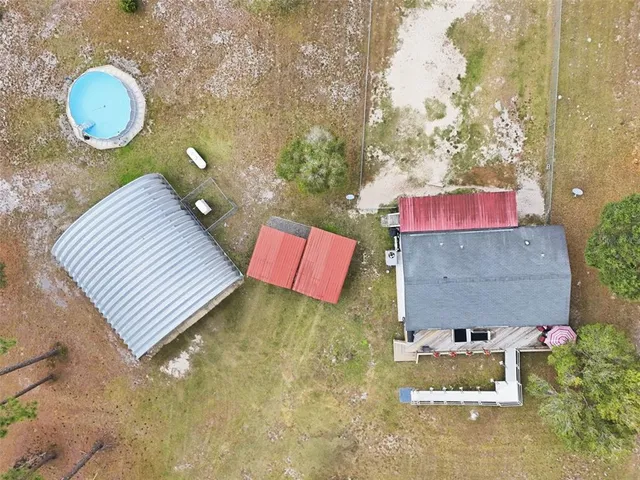a backyard of a house with outdoor seating