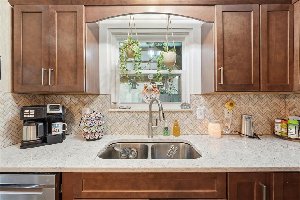 104 Ferncreek Drive Georgetown, FL 32139 - Photo 7 of 52 a kitchen with sink cabinets and a window